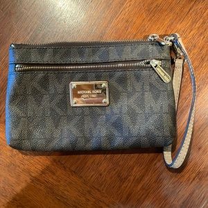 Michael Kors Wallet. Outer zipper. Card holder built inside. Small strap